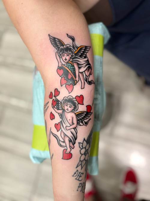 Traditional-style cherub tattoos with hearts